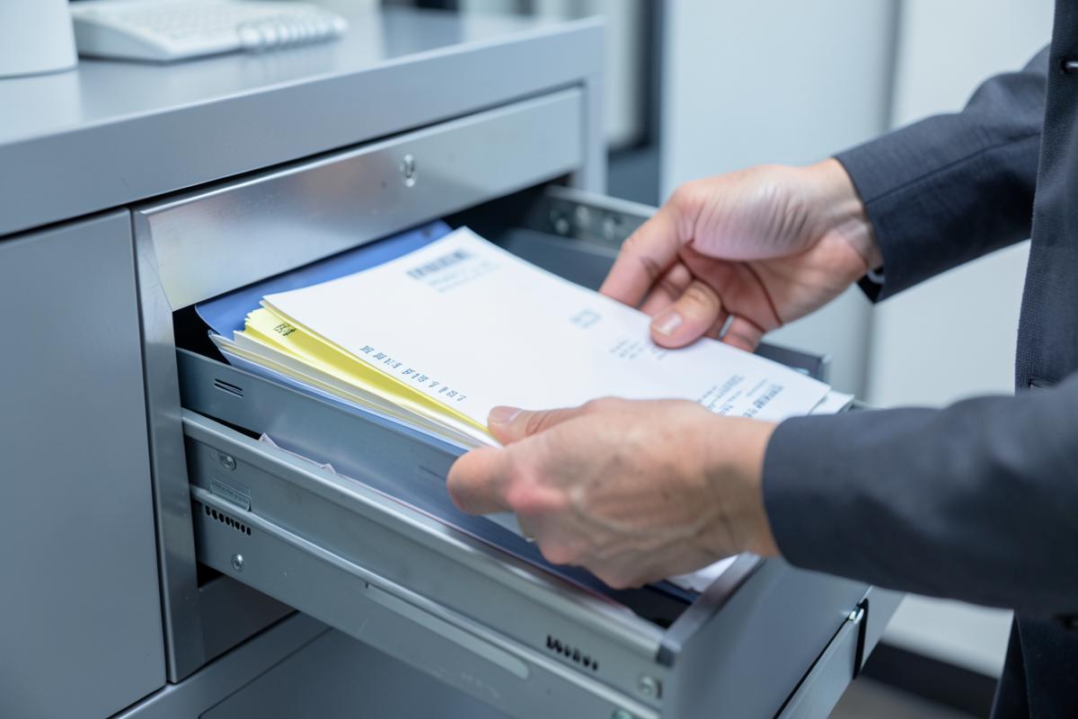 Filing labeled folders in a records cabinet